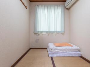 Postel nebo postele na pokoji v ubytování Business Hotel Kaga
