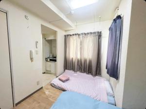 Postel nebo postele na pokoji v ubytování MATUBARA HOUSE + 27 fotografií