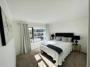 Ένα ή περισσότερα κρεβάτια σε δωμάτιο στο Matuhi Deluxe 2 bedrooms unit