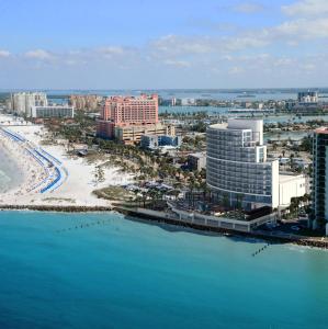 an aerial view of a city with a beach and buildings at Opal Sands in Clearwater Beach