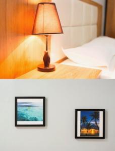Una cama o camas en una habitación de Pacific Islander Inn