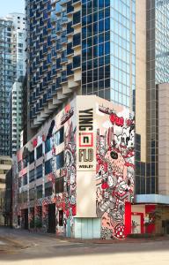 a building with a mural on the side of it at Ying'nFlo, Wesley Admiralty, Hong Kong in Hong Kong