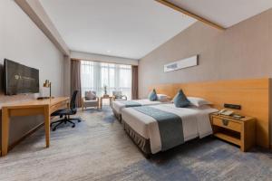 Cama o camas de una habitación en FLIPORT Hotel Xiamen Software Park