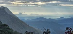 a view of a valley with mountains in the distance at Hilltop Guest House in Ella