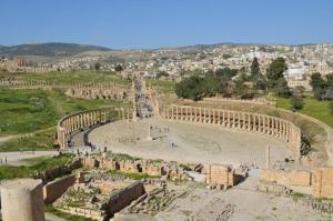 an aerial view of the ancient amphitheater at Ruins Hotel Jerash in Jerash