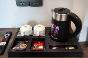 Příslušenství pro přípravu čaje a kávy v ubytování HOTEL CÁT ANH