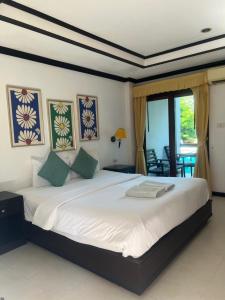 Ліжко або ліжка в номері Samui Seabreeze Place