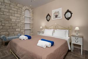 Posteľ alebo postele v izbe v ubytovaní Orelia Cretan Deluxe Apartments