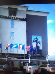 a building with a large screen on the side of it at Villa toscana Victoria island oniru in Lagos