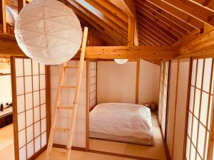 a room with a bunk bed and a ladder at Villa Amatsuboshi - Vacation STAY 83624v in Tahara