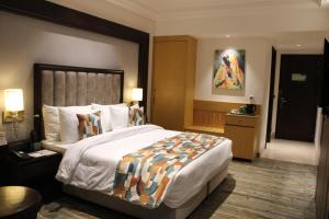 Voodi või voodid majutusasutuse BluSalzz Residence Amritsar toas