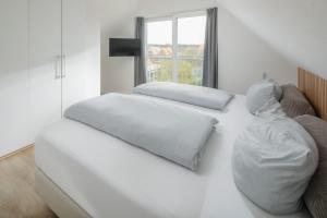 En eller flere senge i et værelse på Haus an den Dünen + 19 billeder