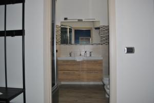 a bathroom with a sink and a toilet at La Terrazza dell’ODEON in Catania