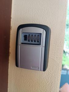 a remote control on the side of a wall at Kuća za odmor in Brzac