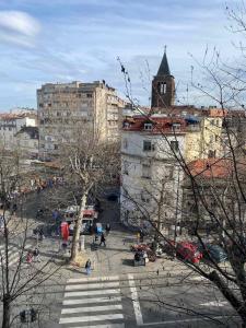 a view of a city with a tower and buildings at Apartman Skadarlija in Belgrade