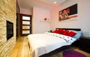 En eller flere senge i et værelse på Apartament Cicha Woda Zakopane