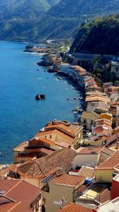 an aerial view of a town next to the water at Scilla Guest House in Scilla