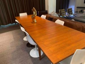 a wooden table with a statue on top of it at STUNNING TROPICAL OASIS free parking in Brisbane +32 photos