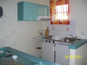 Kuchyň nebo kuchyňský kout v ubytování Apelia Residence