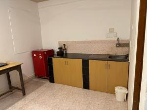 a kitchen with a sink and a counter top at Candolim beach touch flats in Candolim