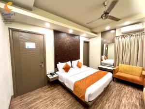 Ένα ή περισσότερα κρεβάτια σε δωμάτιο στο Comfort Inn Silver Arch Hotel, Mussoorie
