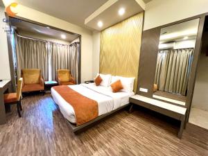 Ένα ή περισσότερα κρεβάτια σε δωμάτιο στο Comfort Inn Silver Arch Hotel, Mussoorie
