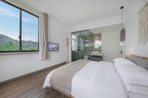 Letto o letti in una camera di 莫干山雅泉山居