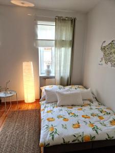 a bedroom with a large bed with a window at Landhaus Domaine de Marie in Illingen