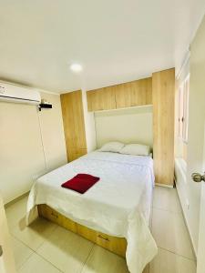 Ένα ή περισσότερα κρεβάτια σε δωμάτιο στο Cozy Peruvian Home