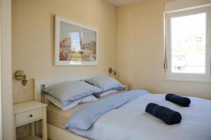 a bedroom with two beds and a window at Kiki's Sea View Studio's in Split