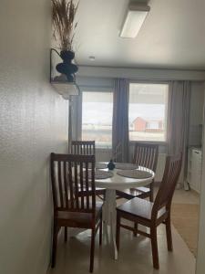 a dining room with a table and two chairs at Saunallinen kaksio 5 in Ylivieska