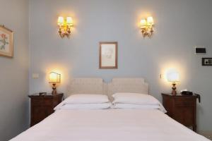 Postel nebo postele na pokoji v ubytování Hotel Hermitage