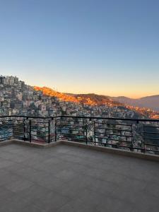 a view of a city from the top of a building at Superb Luxury Three Bed Apartment in Shimla +35 photos