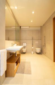 a bathroom with a sink and a toilet at Albergo Sorriso in Boario Terme