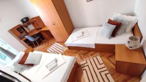 Postel nebo postele na pokoji v ubytování Deluxe Apartman Pervan