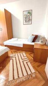 Postel nebo postele na pokoji v ubytování Deluxe Apartman Pervan