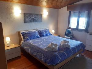Ένα ή περισσότερα κρεβάτια σε δωμάτιο στο Mansarda accogliente a Lusiana