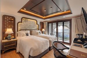 Ένα ή περισσότερα κρεβάτια σε δωμάτιο στο CHINO@NIMMAN Luxury Boutique Hotel +15 φωτογραφίες