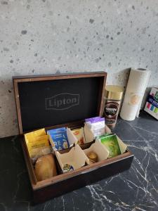 a box of food sitting on top of a counter at Cosy Appartement Paris Ouest in Suresnes