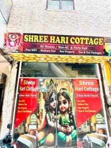 a store with signs on the front of a store at Shri Hari Cottage in Mathura