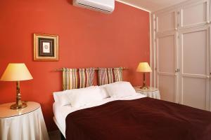 En eller flere senge i et værelse på Casa Karen