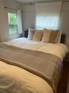Ein Bett oder Betten in einem Zimmer der Unterkunft Retreat Camp Mahoroba