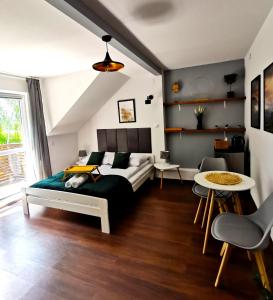 Postel nebo postele na pokoji v ubytování Srokówka Resort