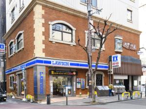 a large brick building on a city street at VESSEL INN NAMBA in Osaka