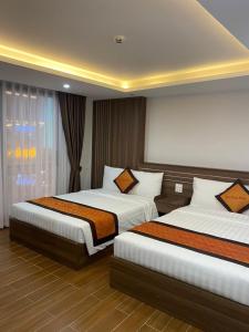 Postel nebo postele na pokoji v ubytování Bảo Châu Hotel Sapa - by Bay Luxury