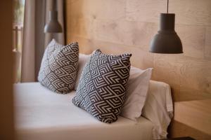 Postel nebo postele na pokoji v ubytování Las Gaviotas Suites Hotel & Spa