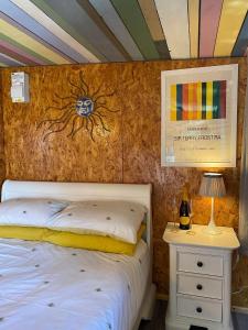 a bedroom with a bed with a spider on the wall at Sunrise Cabin in Carbis Bay
