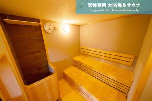 Postel nebo postele na pokoji v ubytování サウテル宇都宮芳賀
