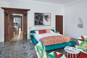 a bedroom with a bed and a living room at Engelwirt Apartments in Berching
