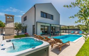 a villa with a swimming pool and a house at Villa MVP in Bibinje